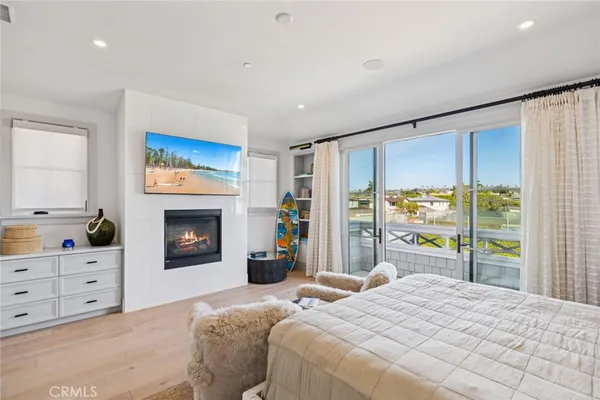 a bedroom with a large bed and a tv