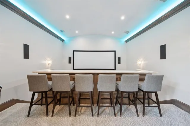 a kitchen with a dining table and chairs