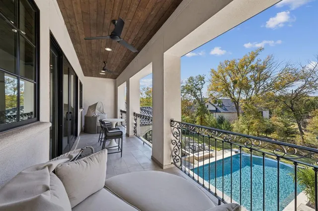 a bedroom with a large bed and a large window