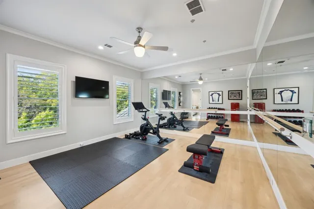 a bedroom with a bed and a large window with outer view