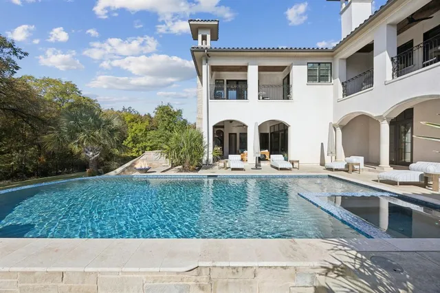a front view of a building with swimming pool