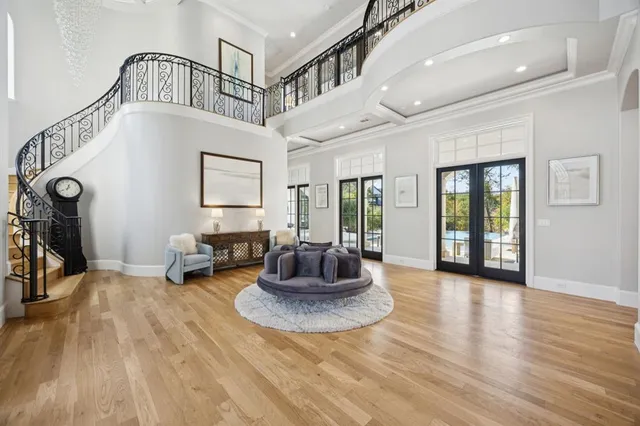 a view of a livingroom with furniture and staircase