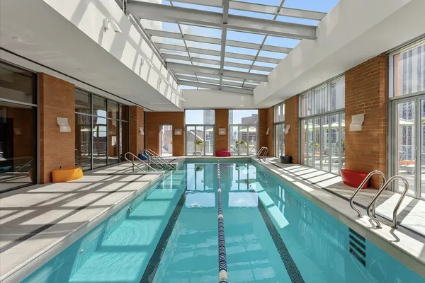 a view of swimming pool with outdoor seating