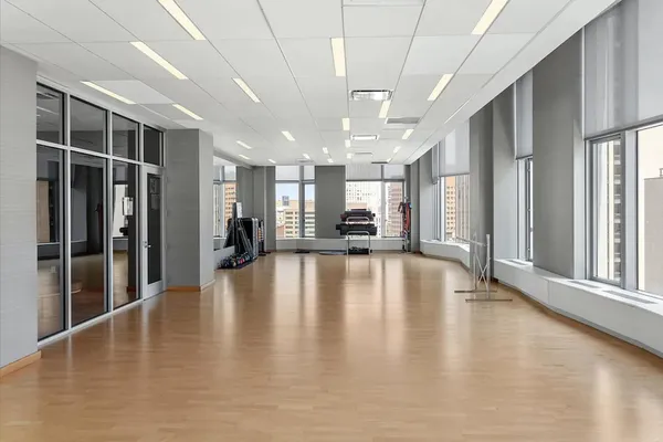 a view of an entryway with wooden floor