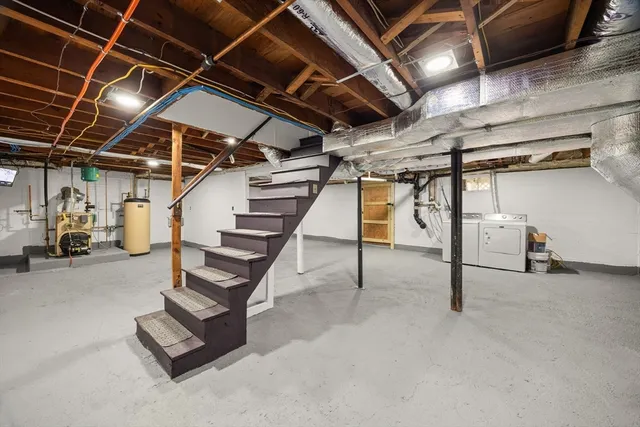 a view of empty room with wooden ceiling