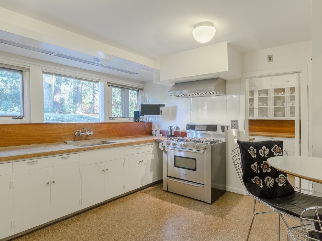 106 Sargent Road Brookline, MA 02445 - Photo 10 of 20 a kitchen that has a sink and a stove