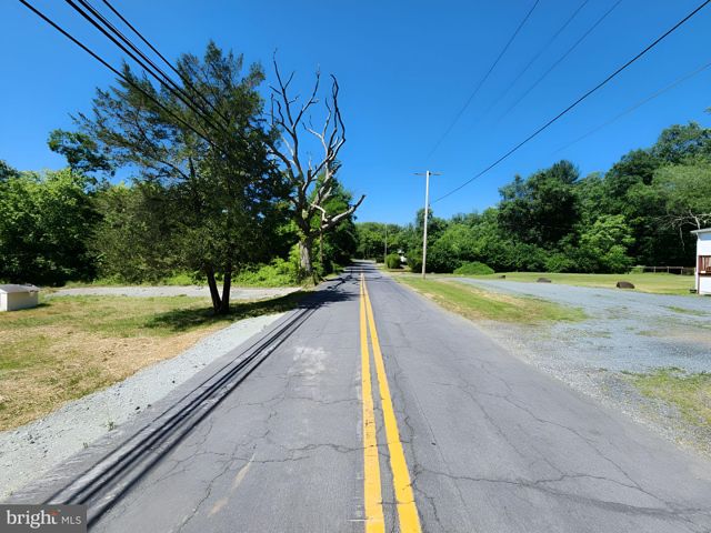 a view of a swimming pool with a yard