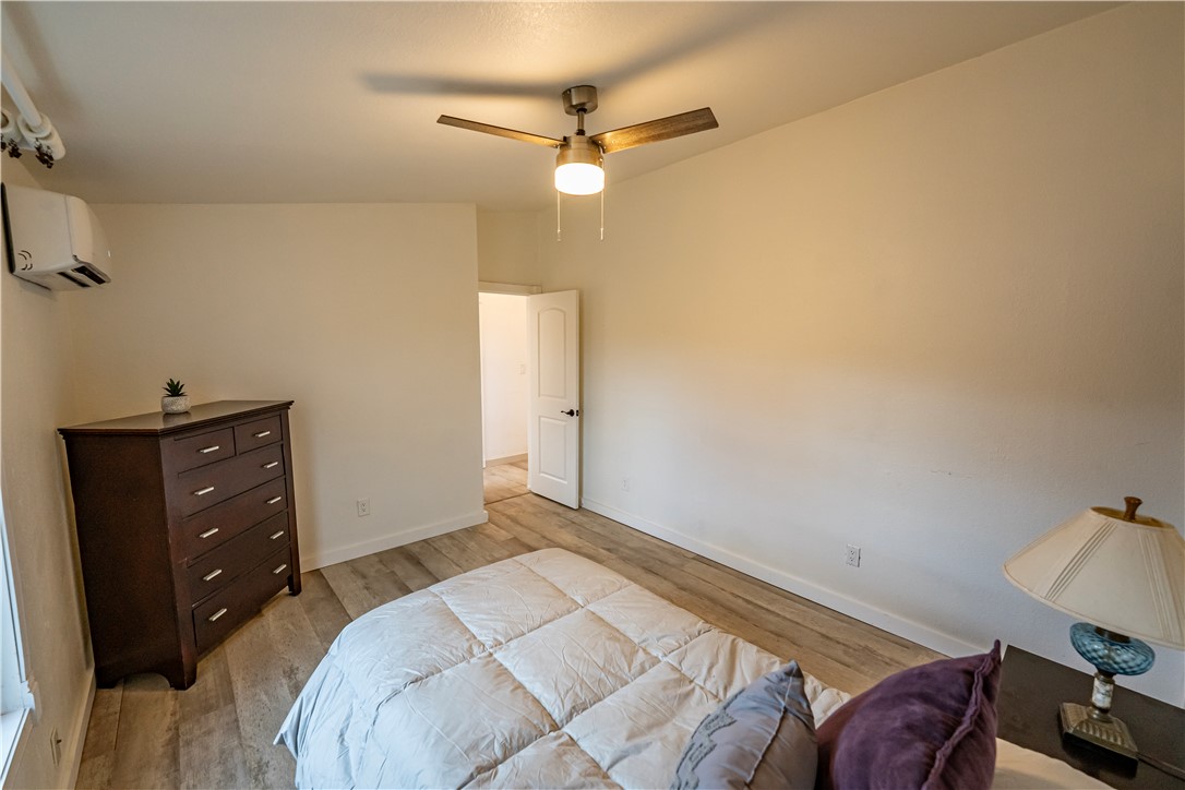 2765 North Silver Springs Road Kingman, AZ 86401 - Photo 28 of 60 a bedroom with a bed and a dresser
