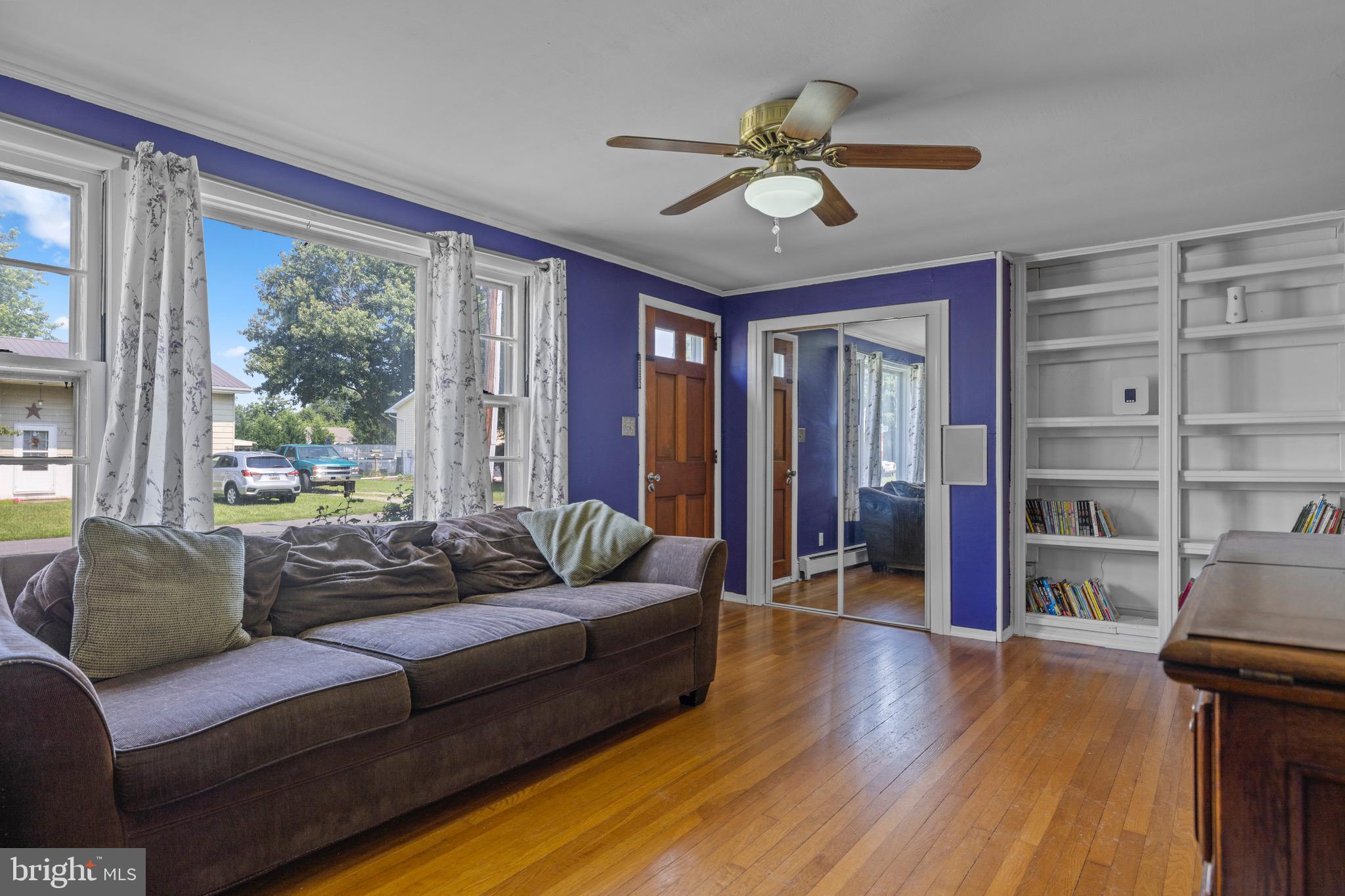 102 Roe Street Greensboro, MD 21639 - Photo 13 of 42 a living room with furniture and a large window