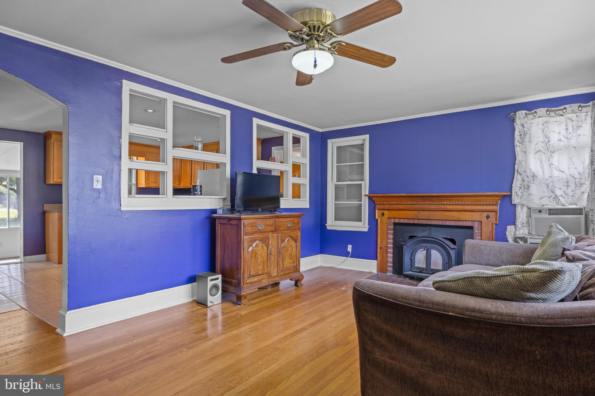 102 Roe Street Greensboro, MD 21639 - Photo 14 of 42 a living room with furniture and a fireplace