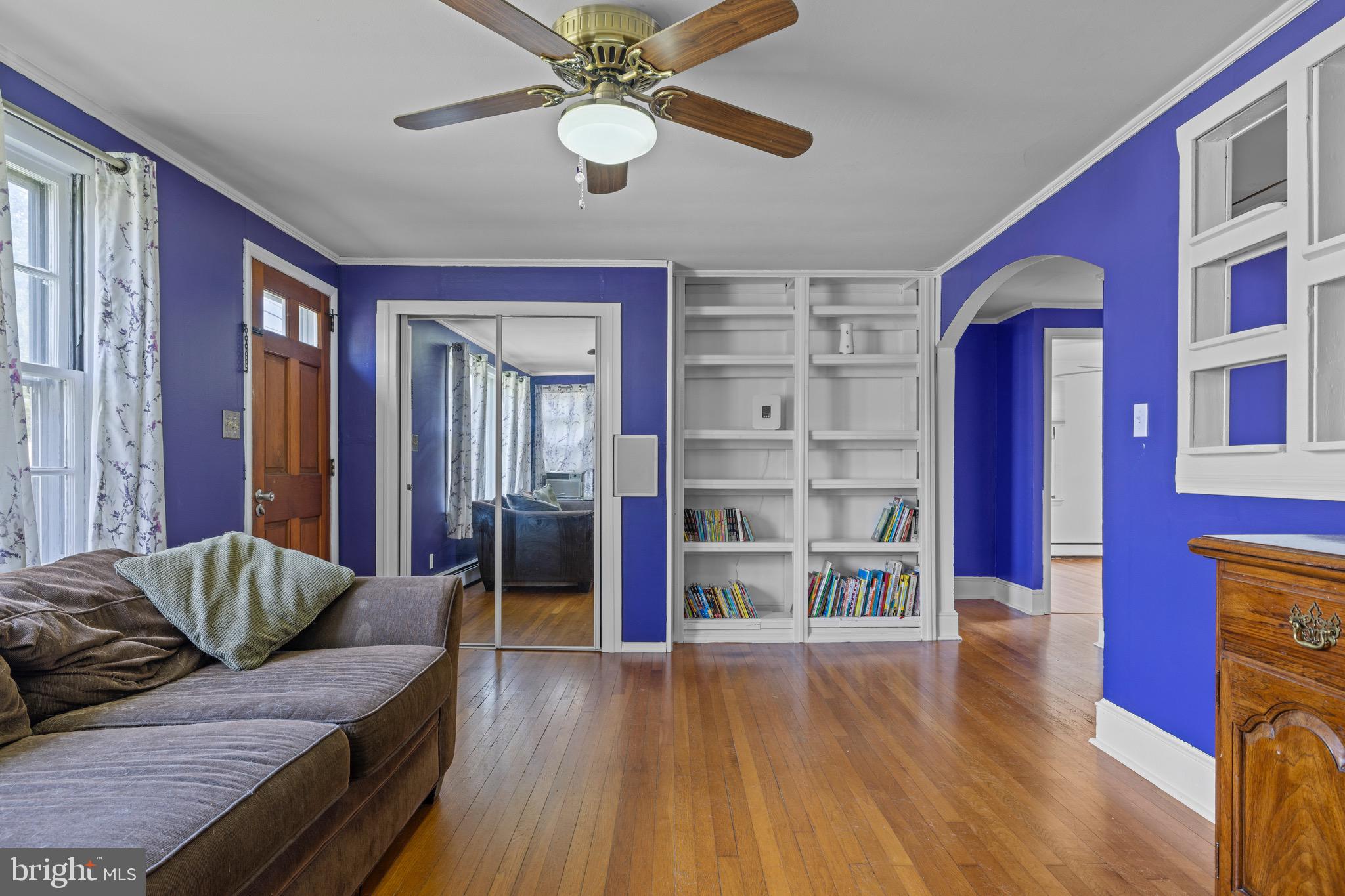 102 Roe Street Greensboro, MD 21639 - Photo 15 of 42 a living room with furniture and wooden floor