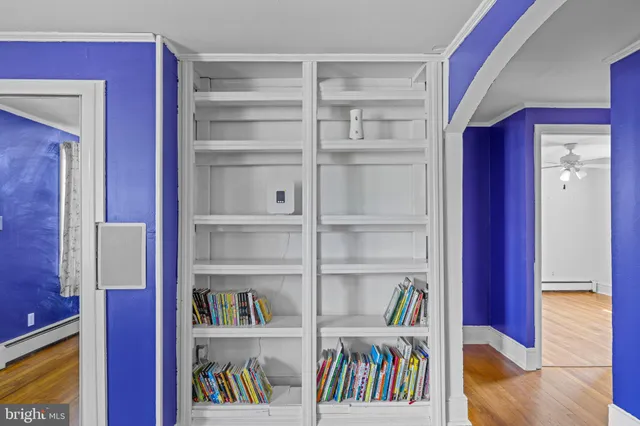 a livingroom with a book shelf