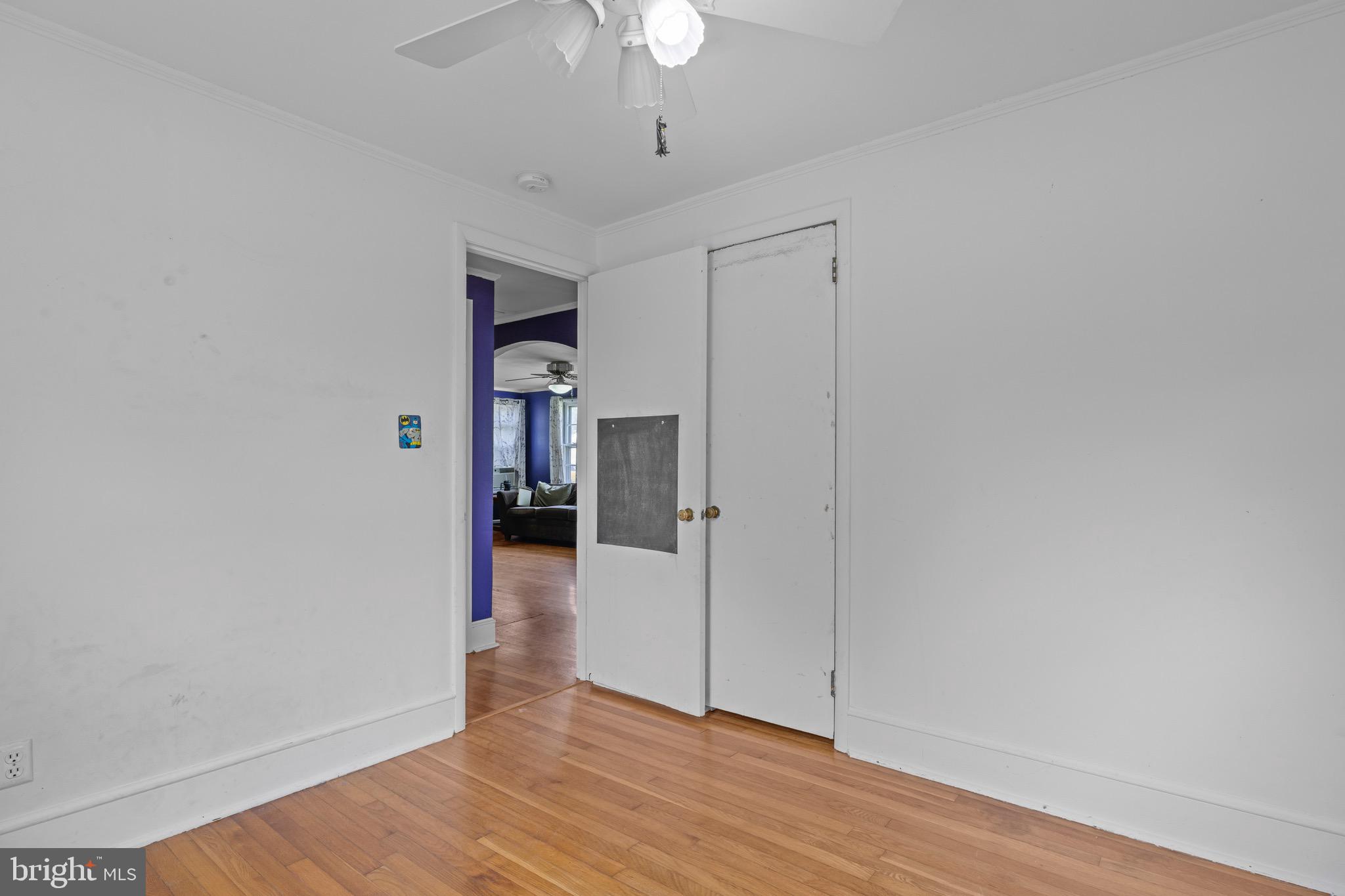 102 Roe Street Greensboro, MD 21639 - Photo 25 of 42 a view of empty room with wooden floor