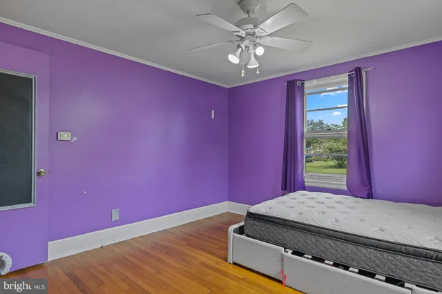 a bed room with a bed and a window