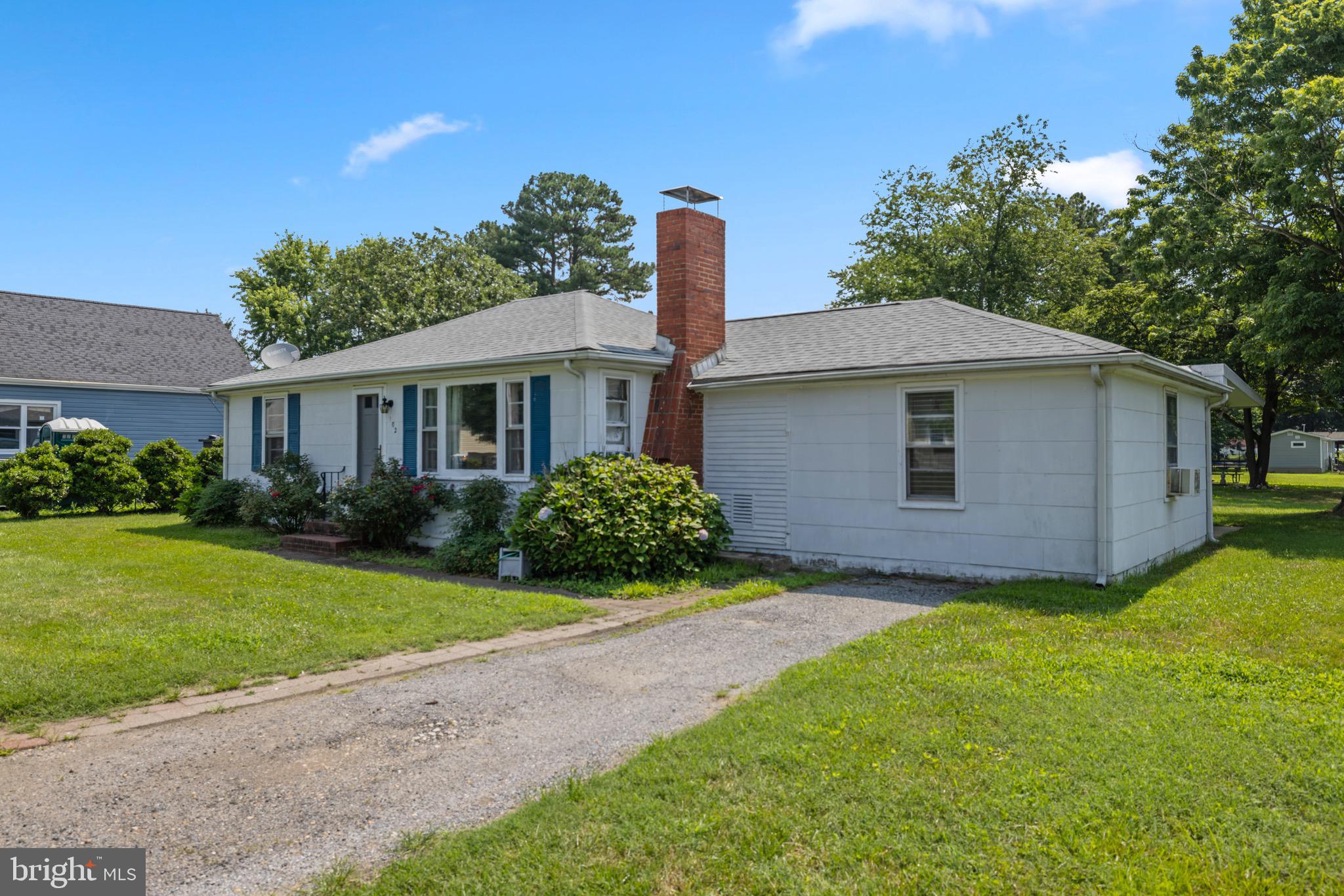 102 Roe Street Greensboro, MD 21639 - Photo 34 of 42 a front view of a house with garden