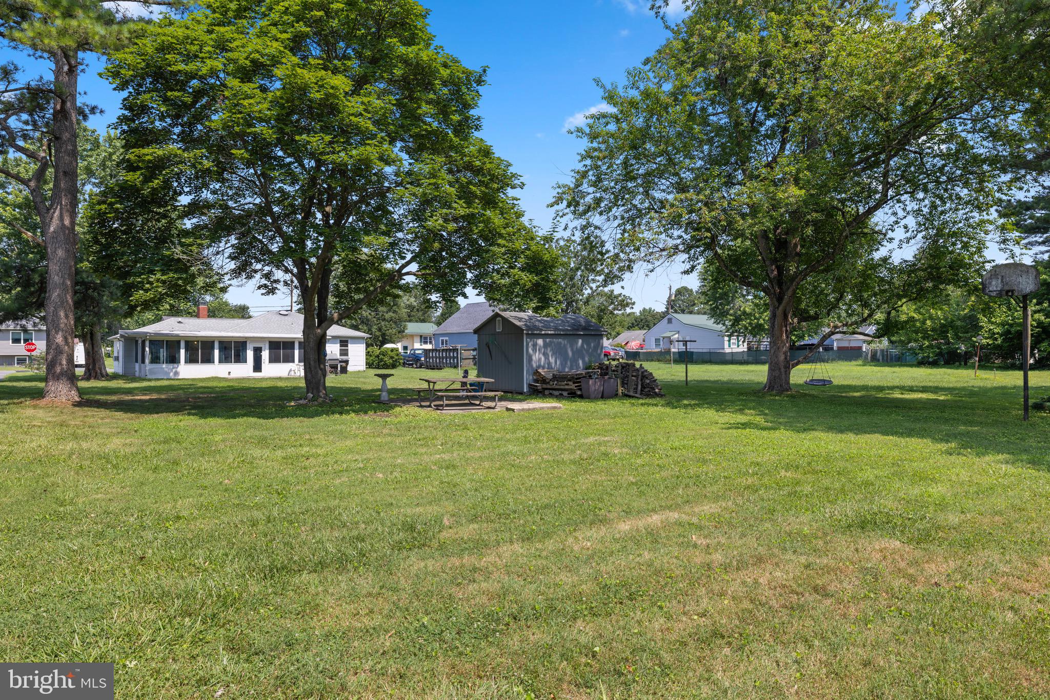 102 Roe Street Greensboro, MD 21639 - Photo 39 of 42 a front view of a house with a garden