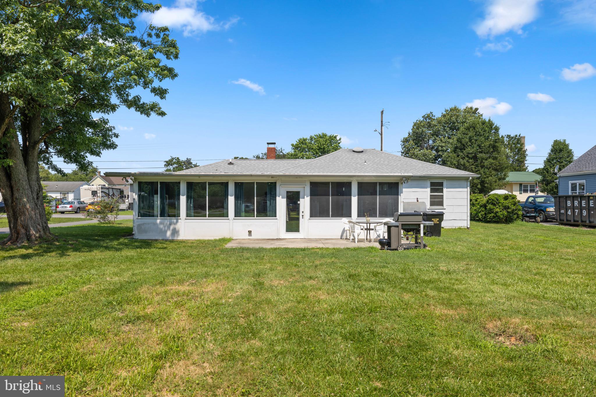 102 Roe Street Greensboro, MD 21639 - Photo 41 of 42 a front view of a house with a garden