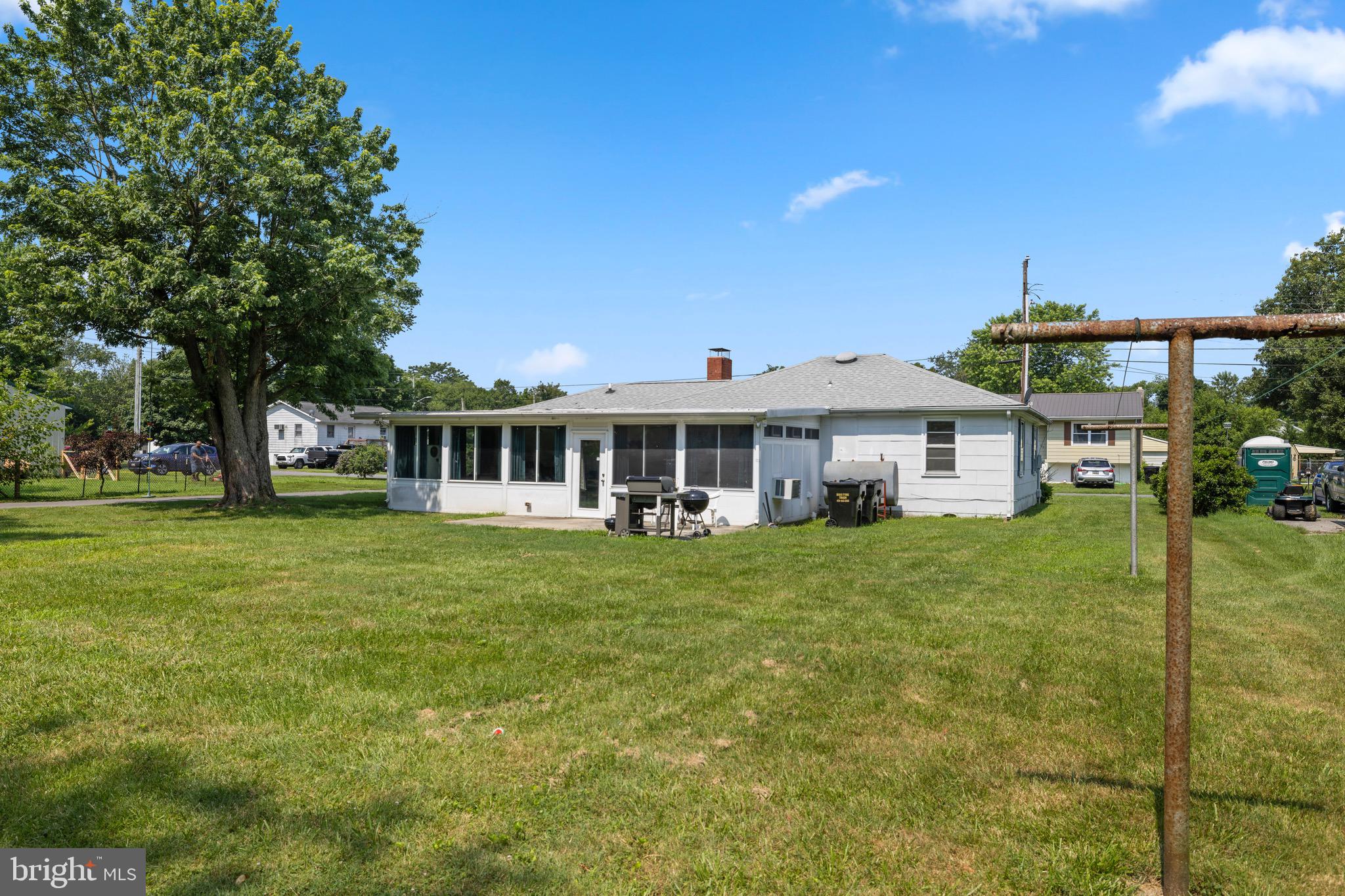 102 Roe Street Greensboro, MD 21639 - Photo 42 of 42 a front view of a house with a garden