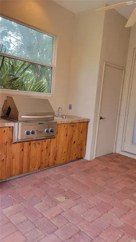 a couple of palm trees in front of house