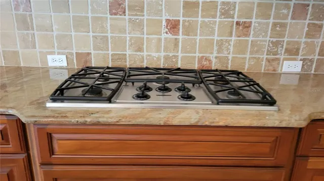 a close view of a stove a sink and dishwasher