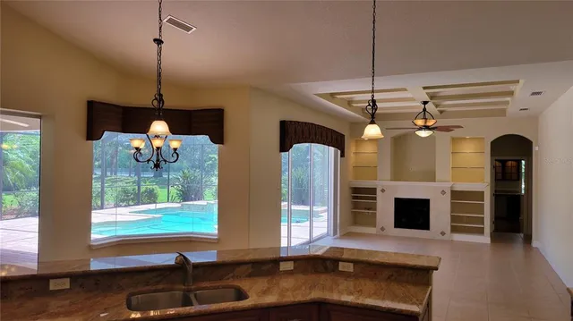 a room with window and chandelier