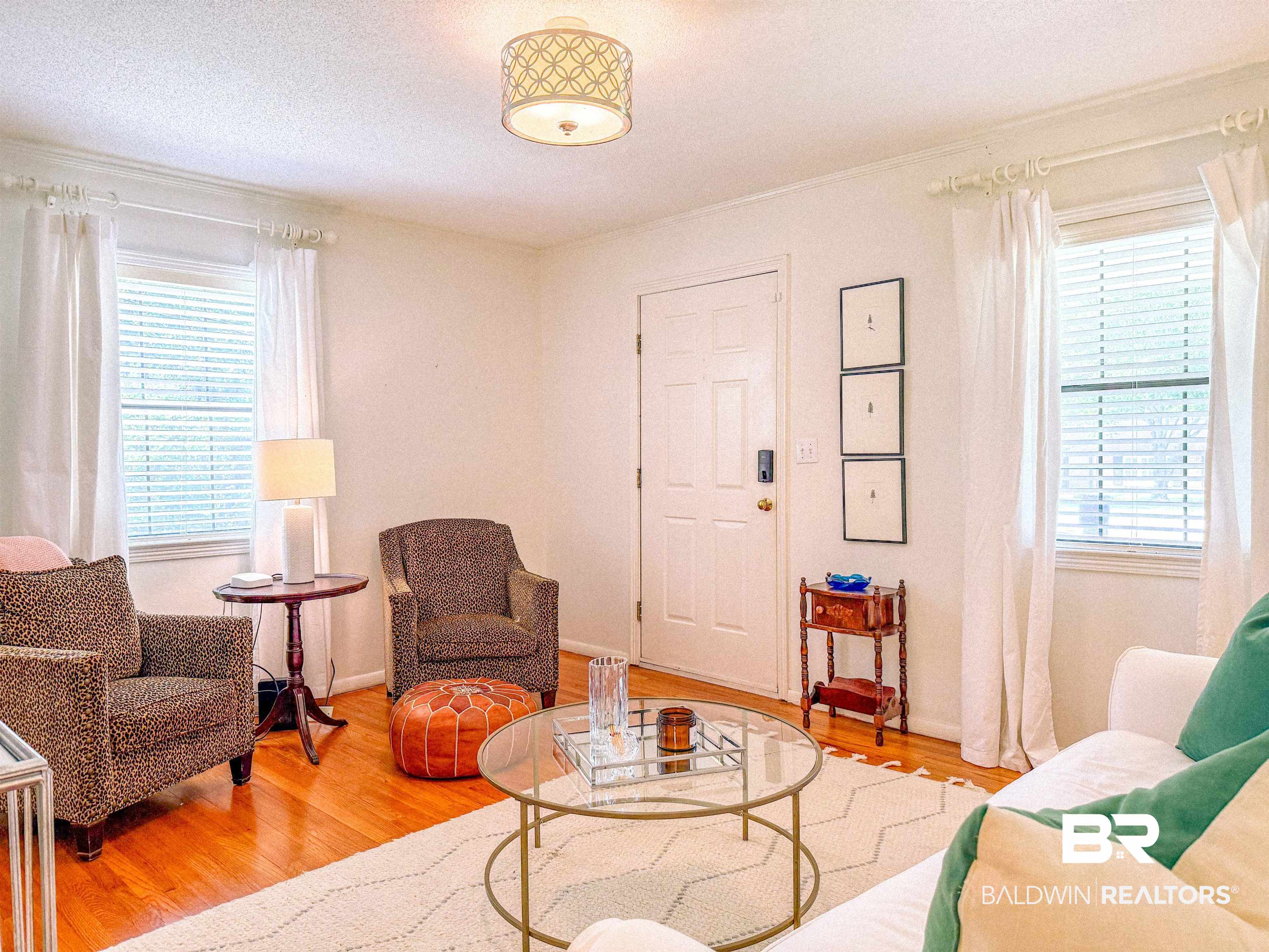 1508 Poplar Avenue Brewton, AL 36426 - Photo 5 of 22 Living area with wood finished floors and a textured ceiling