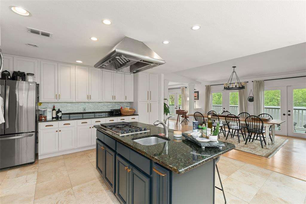 101 Lee Street Windermere, FL 34786 - Photo 22 of 63 a kitchen with sink refrigerator and cabinets