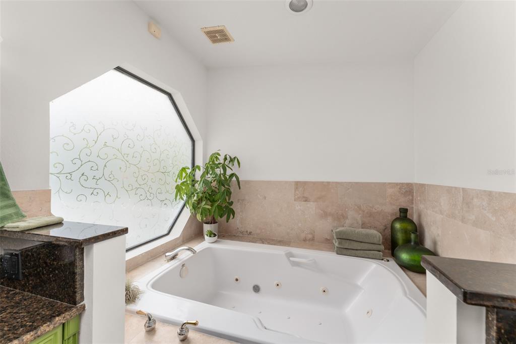 101 Lee Street Windermere, FL 34786 - Photo 33 of 63 a white bath tub sitting in a bathroom