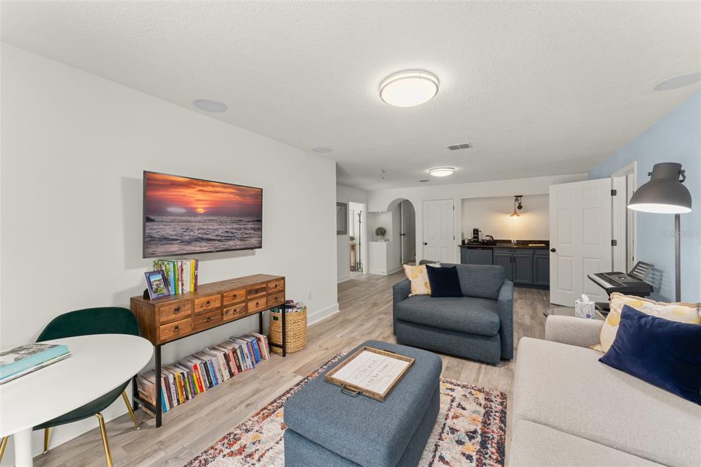 101 Lee Street Windermere, FL 34786 - Photo 38 of 63 a living room with furniture and a flat screen tv