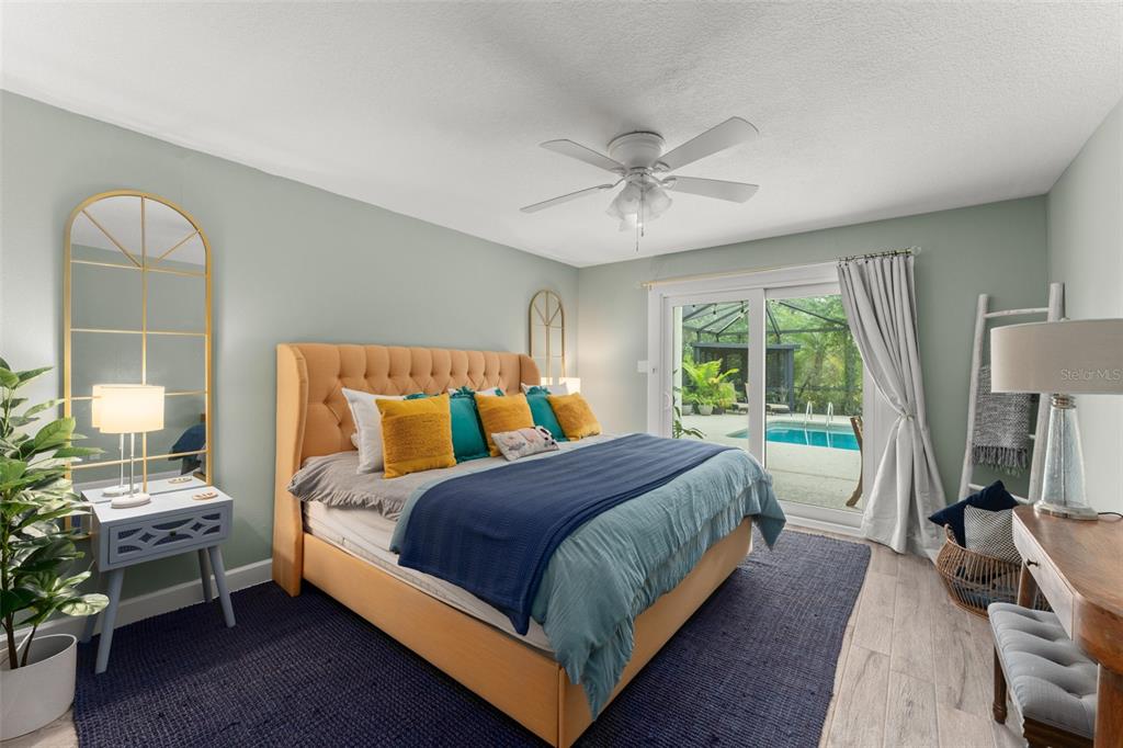 101 Lee Street Windermere, FL 34786 - Photo 42 of 63 a bedroom with a bed and a chandelier