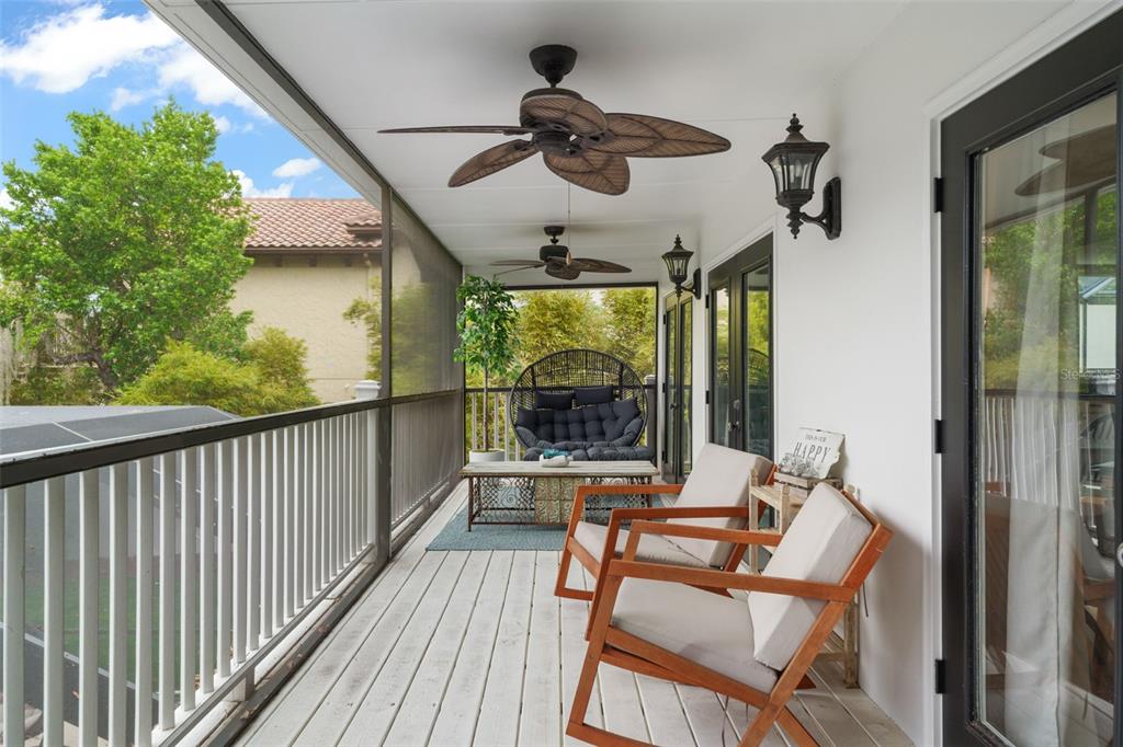 101 Lee Street Windermere, FL 34786 - Photo 47 of 63 a view of a balcony with furniture and wooden floor