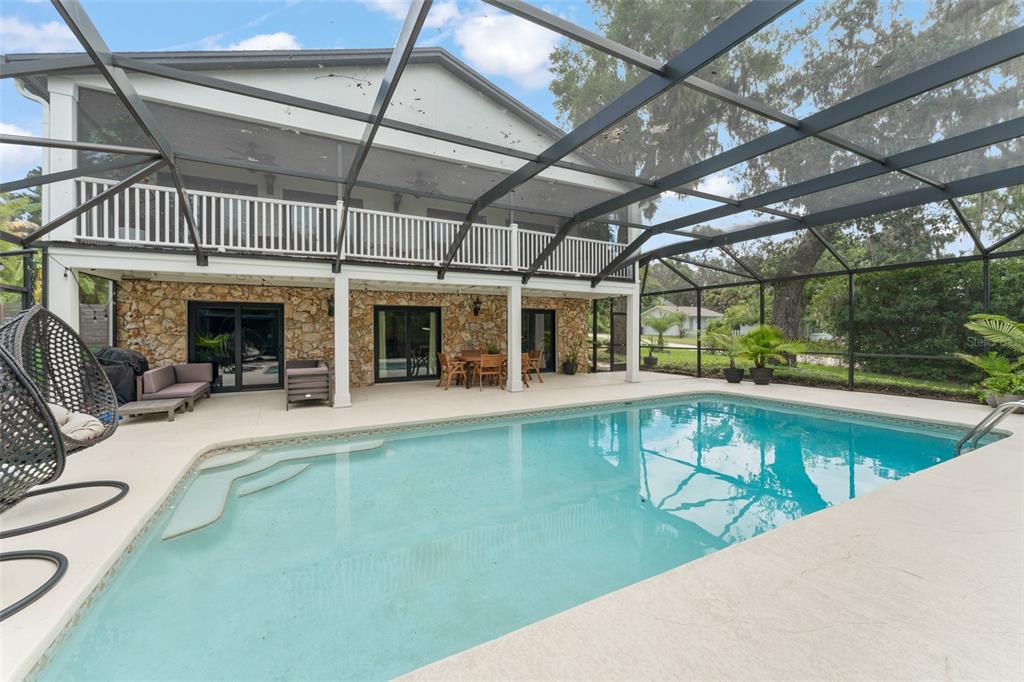 101 Lee Street Windermere, FL 34786 - Photo 49 of 63 a view of a swimming pool with a patio