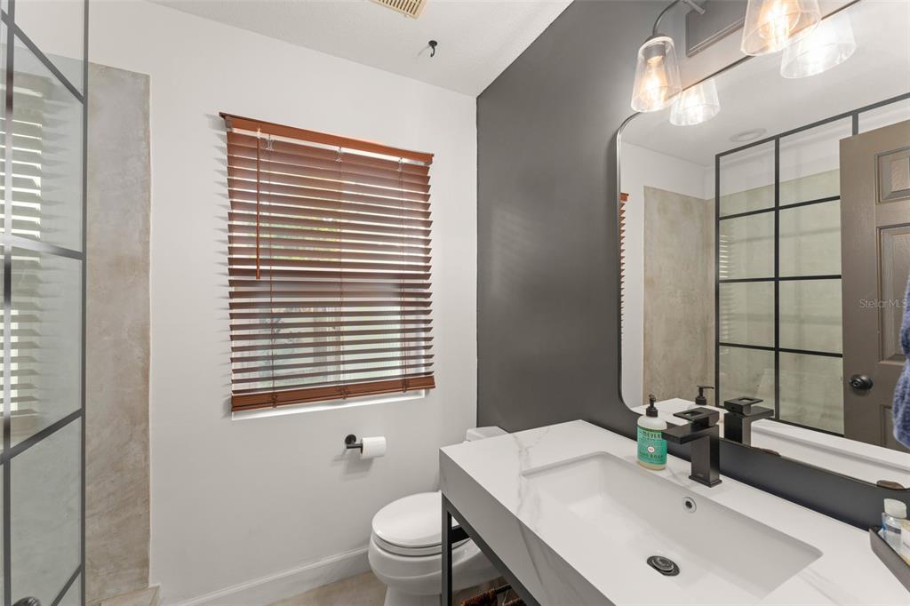 101 Lee Street Windermere, FL 34786 - Photo 10 of 63 a bathroom with a sink toilet and mirror