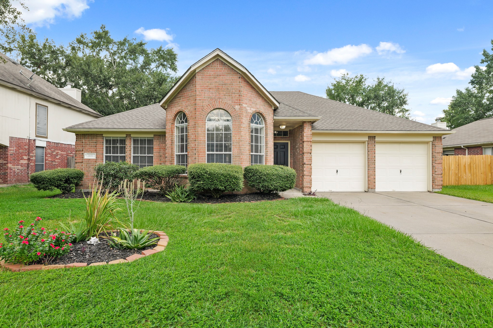 3651 Woodlace Drive Humble, TX 77396 - Photo 1 of 38 a view of a front of house with a yard