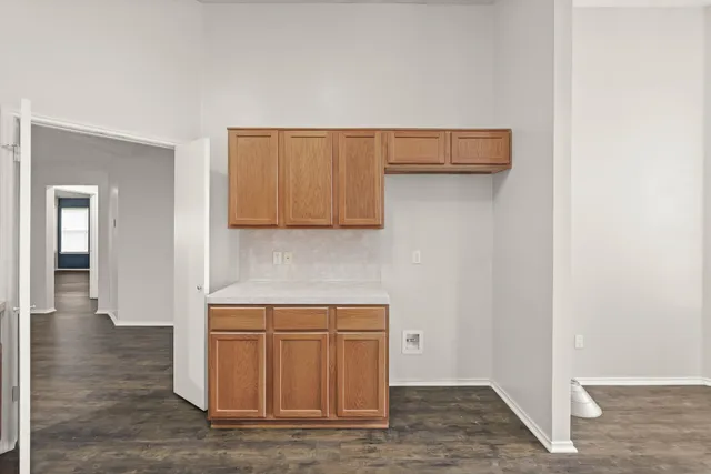 a view of a kitchen with wooden floor