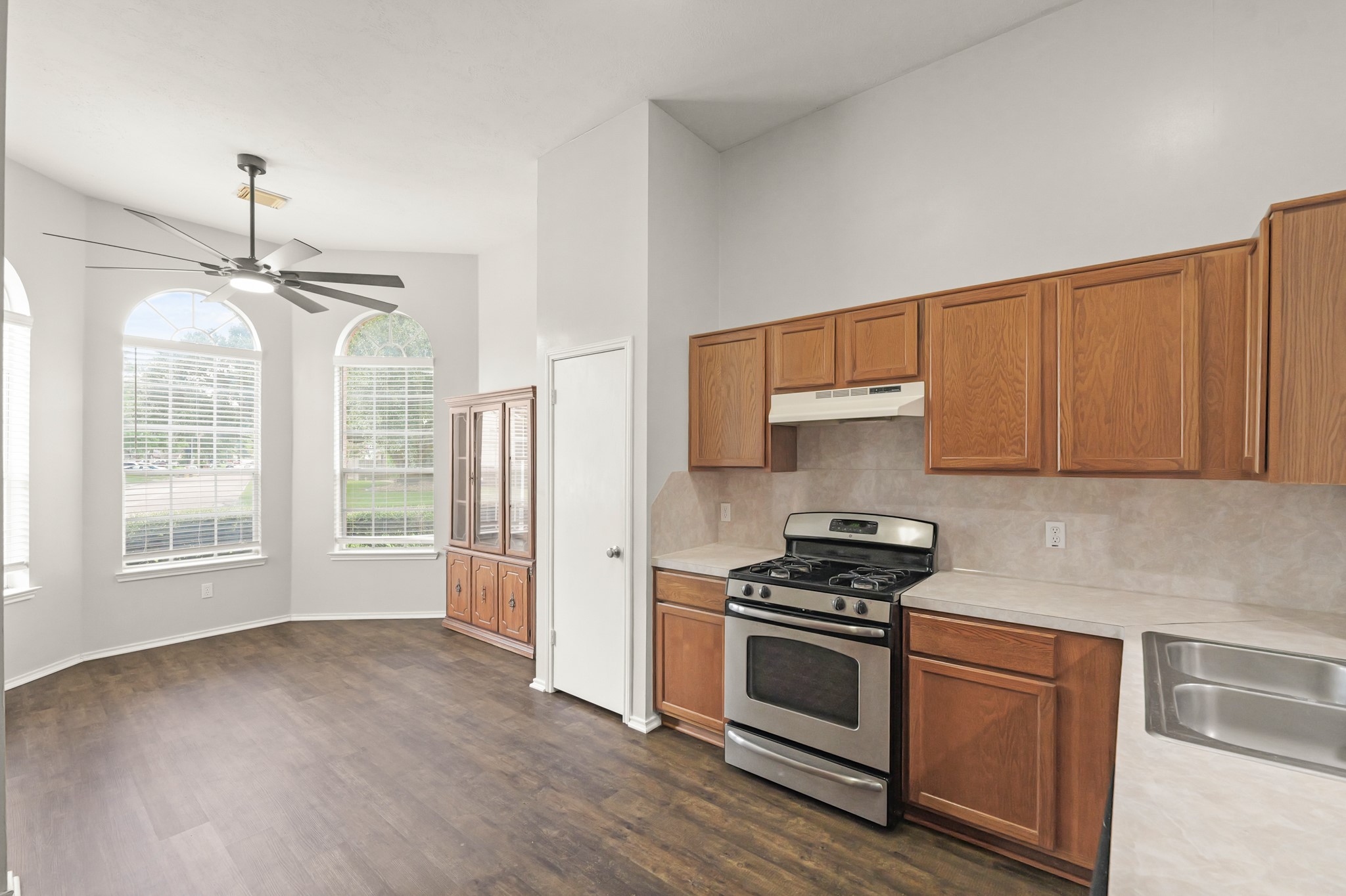 3651 Woodlace Drive Humble, TX 77396 - Photo 15 of 38 a kitchen with granite countertop a stove and a refrigerator