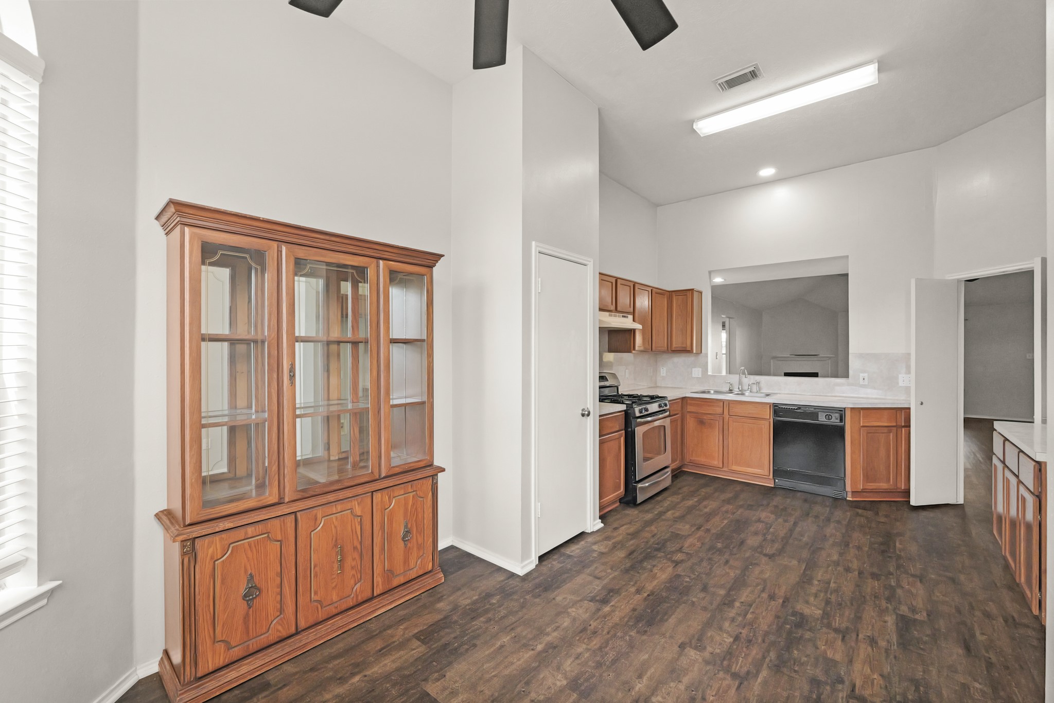 3651 Woodlace Drive Humble, TX 77396 - Photo 17 of 38 a large kitchen with a large window and stainless steel appliances