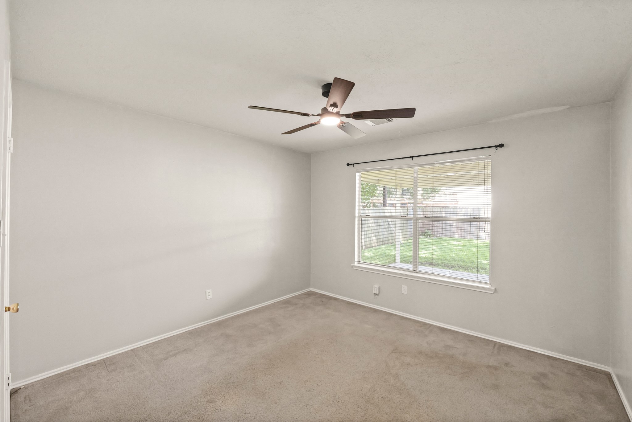 3651 Woodlace Drive Humble, TX 77396 - Photo 18 of 38 a view of an empty room with a window