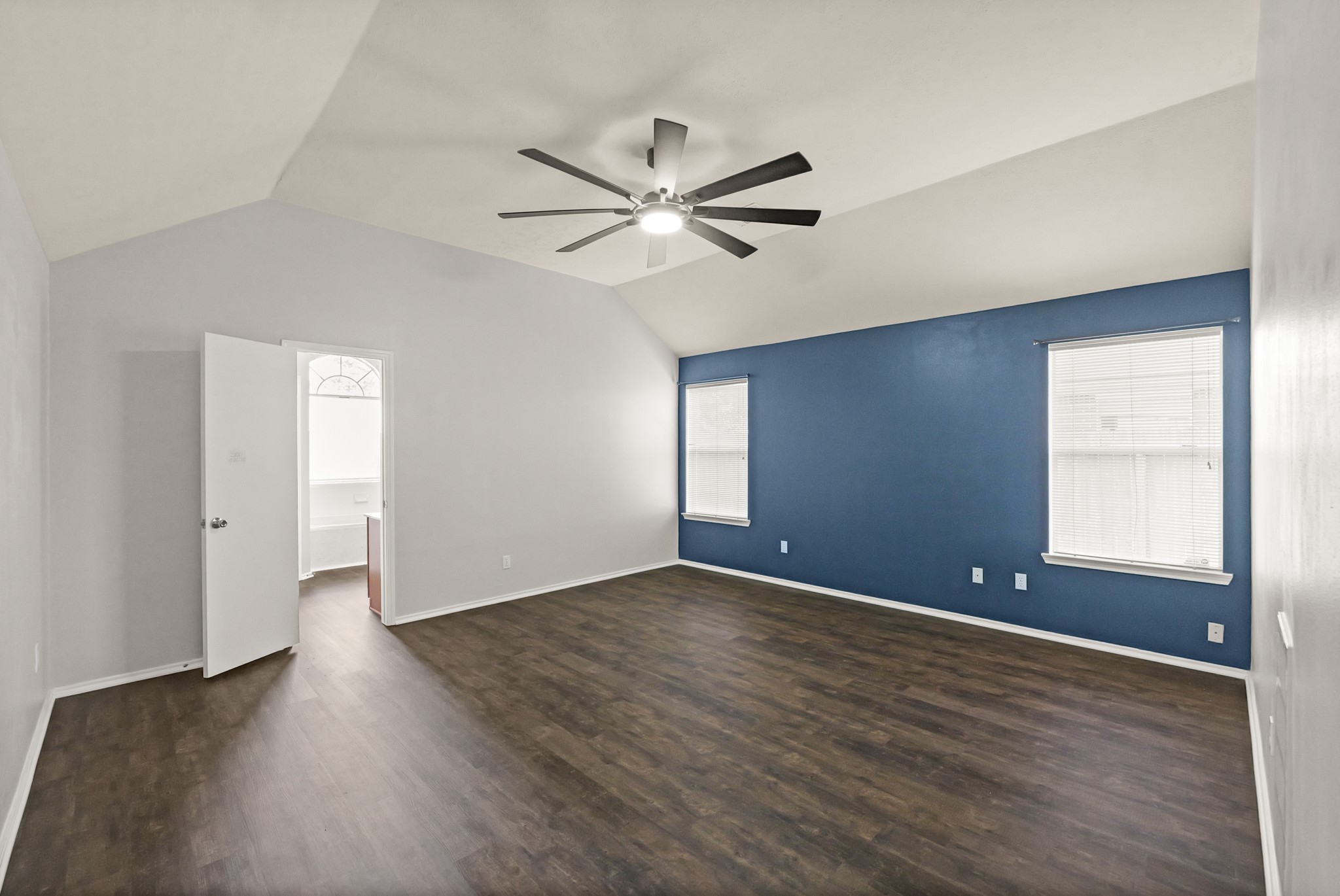 3651 Woodlace Drive Humble, TX 77396 - Photo 24 of 38 an empty room with wooden floor and windows