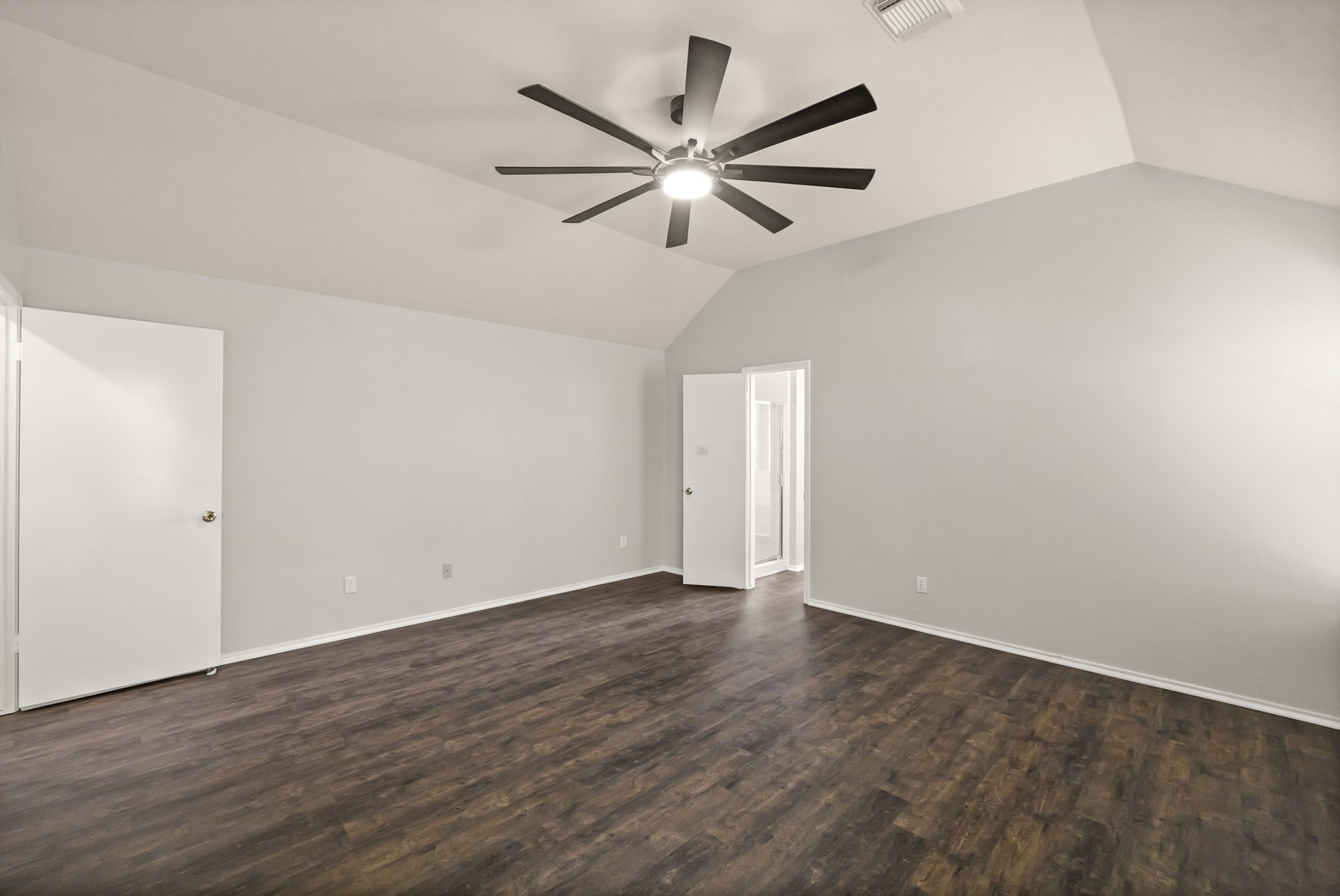 3651 Woodlace Drive Humble, TX 77396 - Photo 27 of 38 an empty room with wooden floor and ceiling fan