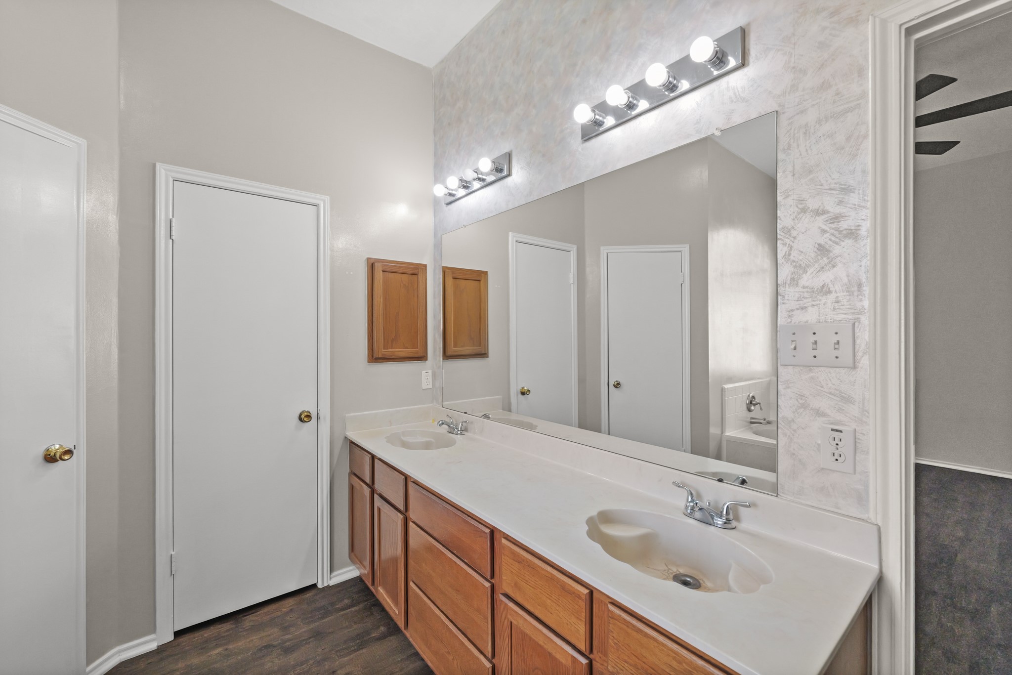 3651 Woodlace Drive Humble, TX 77396 - Photo 28 of 38 a bathroom with 2 sink and a mirror
