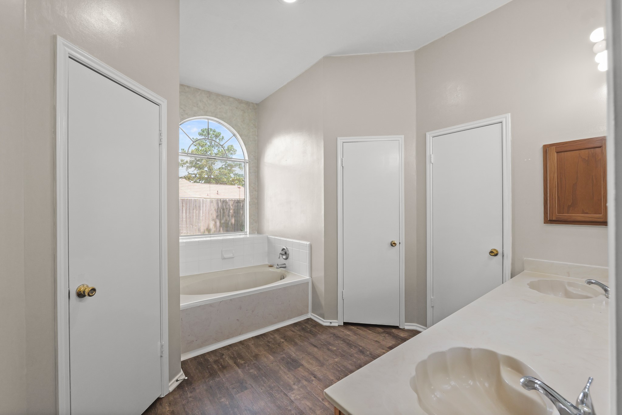 3651 Woodlace Drive Humble, TX 77396 - Photo 31 of 38 a bathroom with a sink and a bathtub