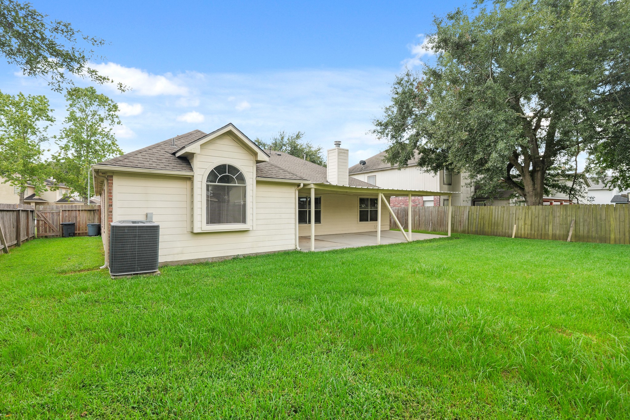 3651 Woodlace Drive Humble, TX 77396 - Photo 34 of 38 a front view of a house with yard and green space