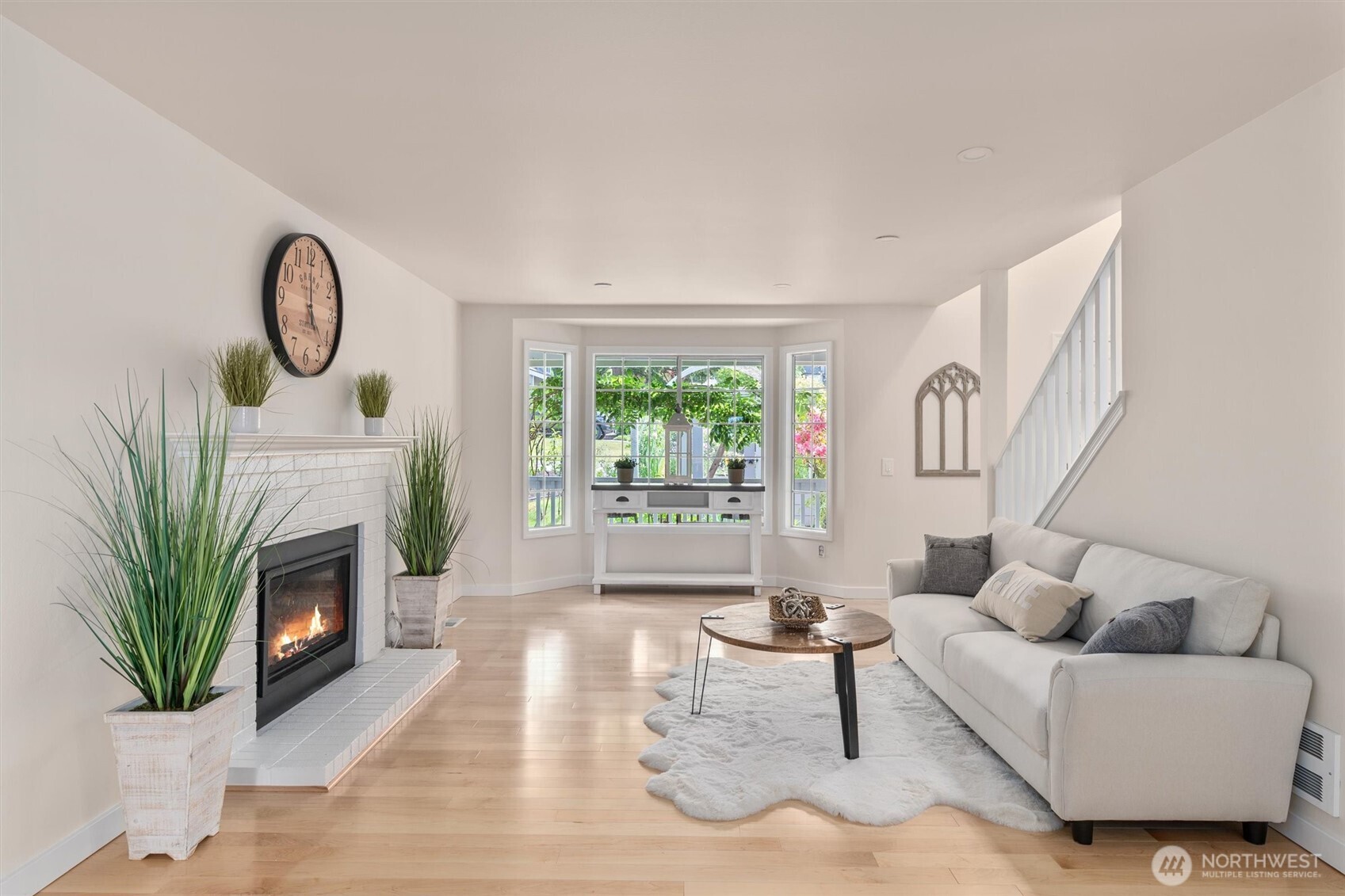 2101 233rd Street Southeast Bothell, WA 98021 - Photo 5 of 40 a living room with furniture a fireplace and a potted plant