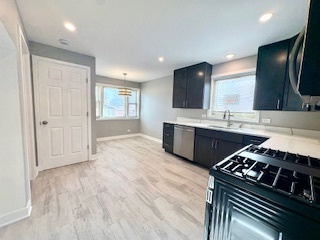10353 South Spaulding Avenue Chicago, IL 60655 - Photo 11 of 21 a kitchen with stainless steel appliances a sink stove and cabinets