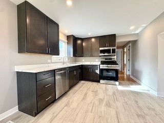 10353 South Spaulding Avenue Chicago, IL 60655 - Photo 13 of 21 a kitchen with stainless steel appliances granite countertop a refrigerator and a stove top oven