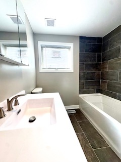 10353 South Spaulding Avenue Chicago, IL 60655 - Photo 8 of 21 a bathroom with a tub a sink and a window