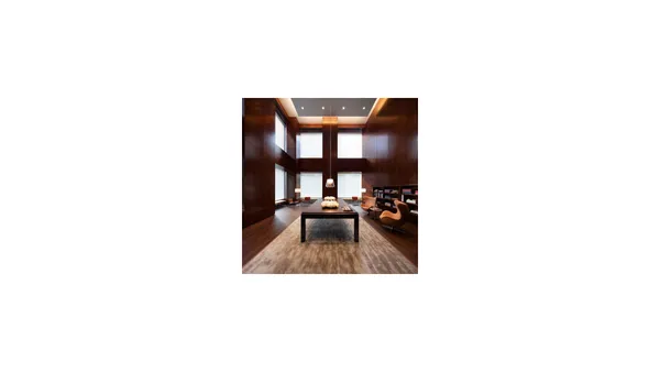 a picture of a living room with a flat screen tv
