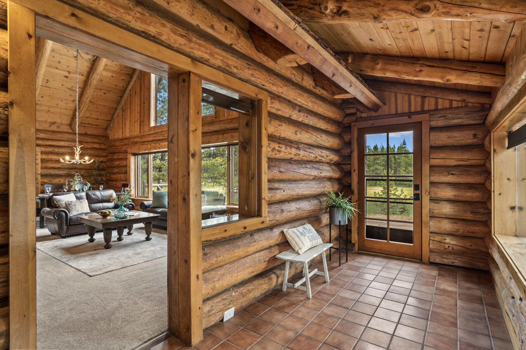 17026 Sharp Drive Bend, OR 97707 - Photo 21 of 72 a view of a porch with chairs and couches with wooden floor