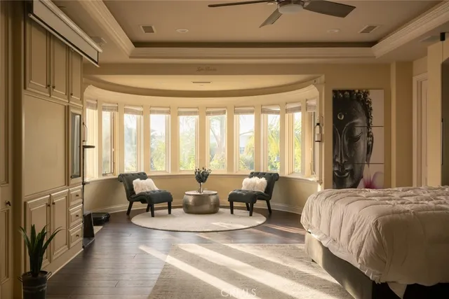 a living room with a bed furniture and a large window